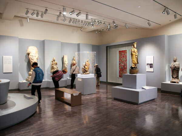 Museum visitors look at artwork in the China galleries.